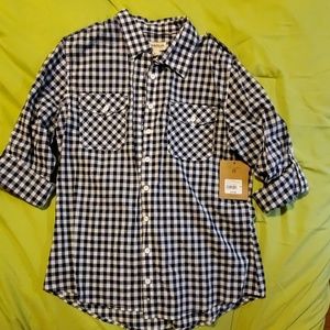 Blue checkered button up shirt.